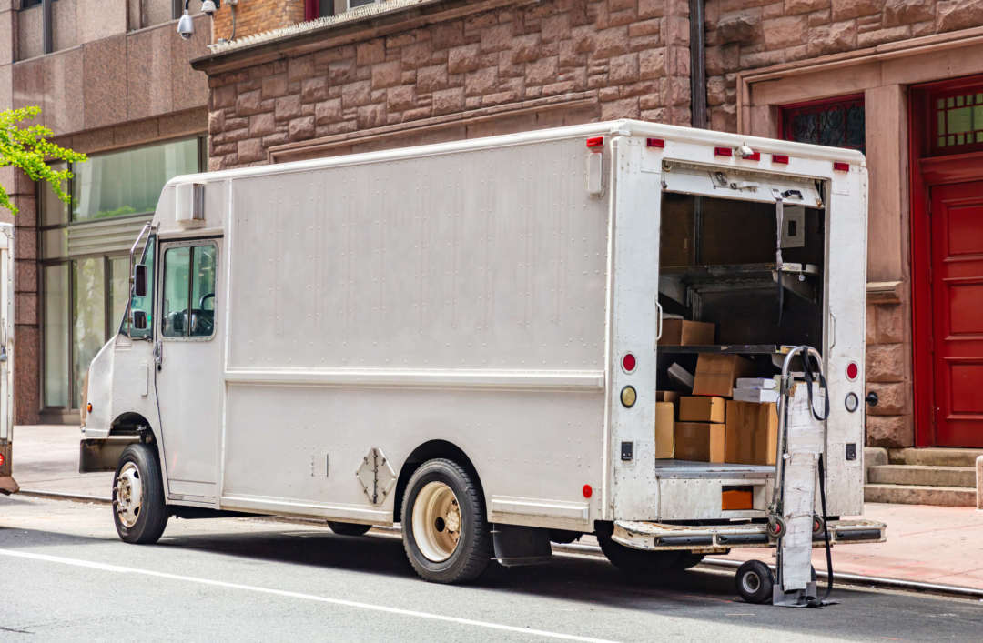 White color truck delivering packages